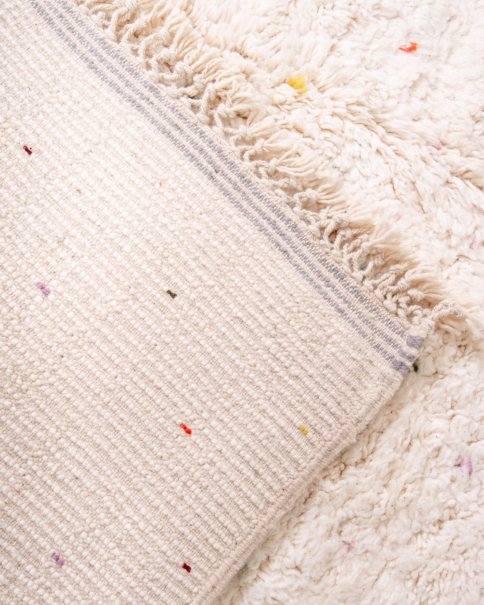 Modern, designer, handcrafted Berber rug from Morocco. Beniourain carpet with beautiful colours and patterns and fluffy wool texture.